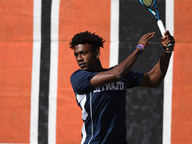 Male tennis player during a match.